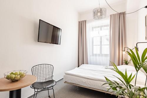 Una cama o camas en una habitación de Hotel Pivoňka