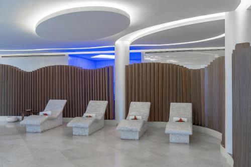 a row of chairs in a room with a ceiling at Pyramid Continental Hotel in Juba