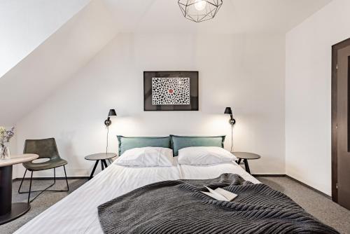 Una cama o camas en una habitación de Hotel Pivoňka