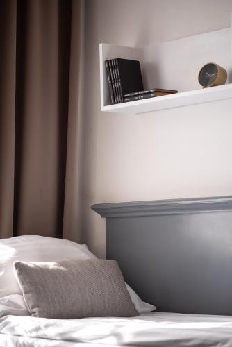 Una cama o camas en una habitación de Hotel Pivoňka