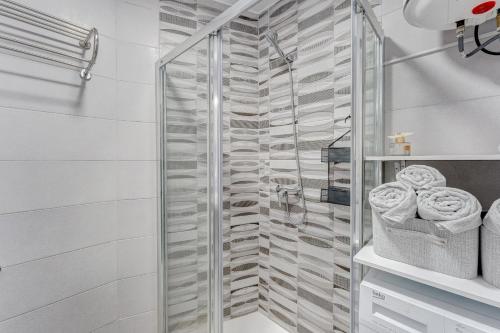 a shower with a glass door in a bathroom at Park Santiago 2 Luxury Studio 8 in Arona