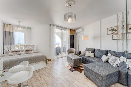 a living room with a bed and a couch at Park Santiago 2 Luxury Studio 8 in Arona