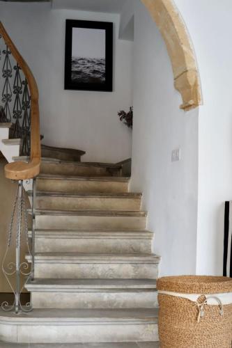 a stairway in a home with a stone staircase at The Old Town Heritage House Platform 357 in Nicosia