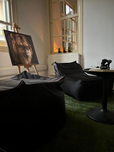 a room with a painting and a table with pillows at The Old Town Heritage House Platform 357 in Nicosia
