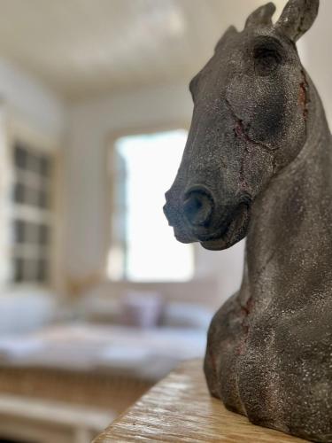 a statue of a cow sitting on a table at The Old Town Heritage House Platform 357 in Nicosia