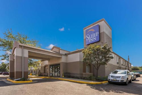 a store with a car parked in front of it at Sleep Inn Sioux Falls Airport in Sioux Falls