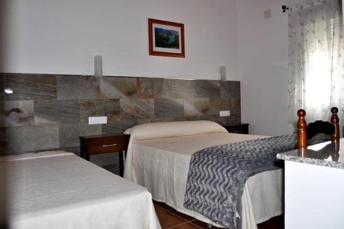 Ένα ή περισσότερα κρεβάτια σε δωμάτιο στο Casa rural Molino S CAZORLA PISCINA COMPARTIDA