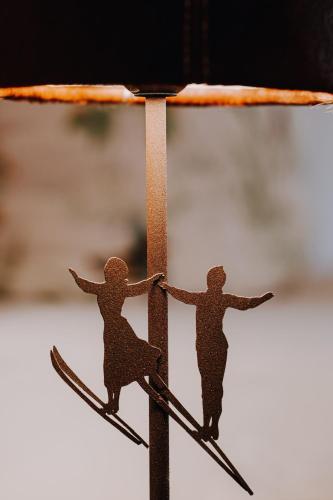 two figurines of people on skis on a pole at Alpenflair Ferienwohnung 317 Alpengrün in Oberstdorf