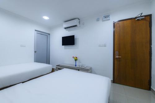 Giường trong phòng chung tại SP Star Hotel