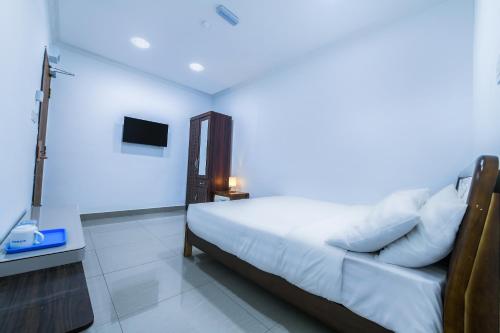 Giường trong phòng chung tại SP Star Hotel
