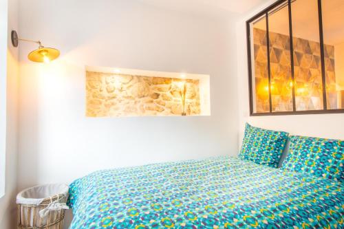 Postel nebo postele na pokoji v ubytování Sauna - Le loft des remparts - FloBNB