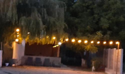 a row of lights on a fence at night at Casa Alexia in Coronini
