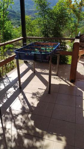 a blue table sitting on top of a patio at Aguaribay cabañas in San Javier
