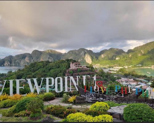 a view of a mountain with the word avalonopolis at PP Midnight Hotel in Phi Phi Don