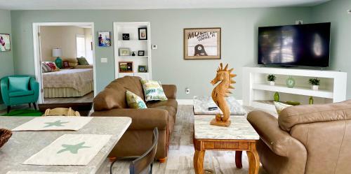 a living room with a couch and a table at Gulf to Golf. in Bradenton