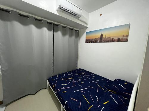 Llit o llits en una habitació de South Residences Tower 3