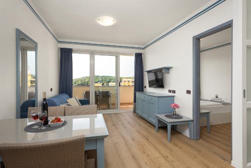 Un ou plusieurs lits dans un hébergement de l'établissement Family Resort del Mar