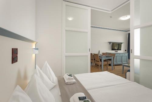 Un ou plusieurs lits dans un hébergement de l'établissement Family Resort del Mar