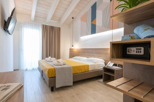 Postel nebo postele na pokoji v ubytování Horizon Hotel Badesi