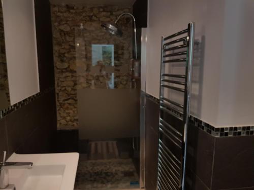 a bathroom with a shower and a sink and a tub at La suite musicale in Villeneuve-Saint-Denis