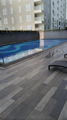 a swimming pool on the roof of a building at Galeri Ciumbuleuit Apartment 3 by Gezonder in Bandung