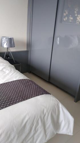 Postel nebo postele na pokoji v ubytování Galeri Ciumbuleuit Apartment 3 by Gezonder