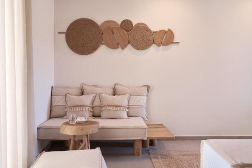 a living room with a couch and a table at Armony Suites Milos in Paliochori
