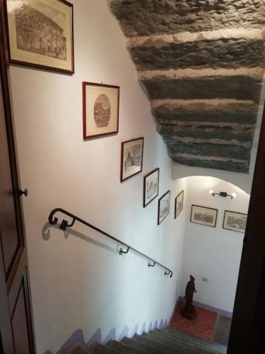 a room with a staircase with a stone ceiling at Ai tre Campi in Fornaci di Barga