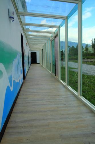 a corridor of a building with a long walkway at Meet Canaan in Xikou