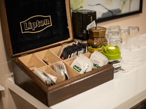 a wooden box of utensils sitting on a table at Boutique Hotel 32 in Batumi
