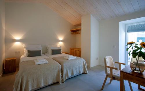 Postel nebo postele na pokoji v ubytování Casa Margô