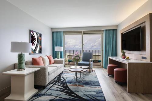 a living room with a couch and a table at Crowne Plaza Resort Guam in Tumon