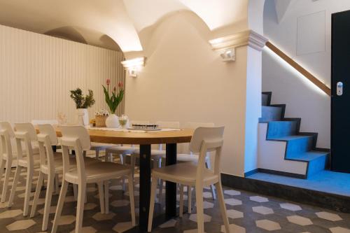 a dining room with a table and chairs at Colonna 24 Luxury Room in Portovenere near 5 Terre in Portovenere