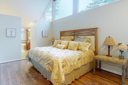 a bedroom with a bed and a large window at Newport Dr 82 in Ocean Pines