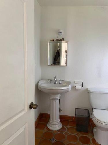 a bathroom with a sink and a toilet at Miami guest house with large pool in Miami