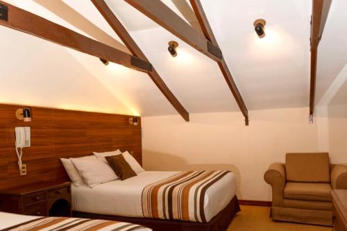 Ein Bett oder Betten in einem Zimmer der Unterkunft San Juan Suites