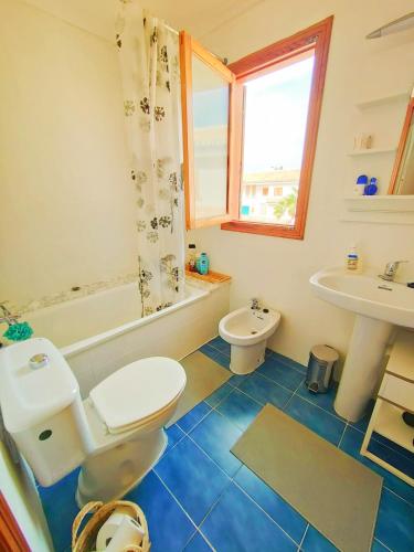 a bathroom with a toilet and a sink at Blue House in Santa Pola in Santa Pola