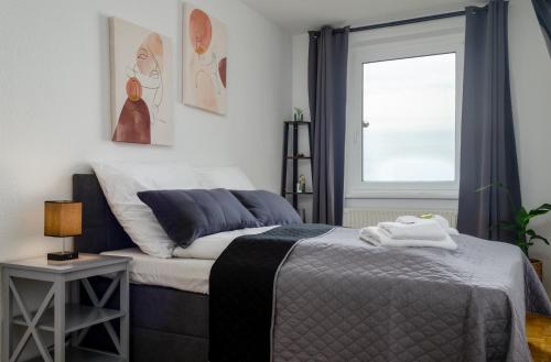 Voodi või voodid majutusasutuse JeyFL Apartments: Zentral - stilvoll - komfortabel toas