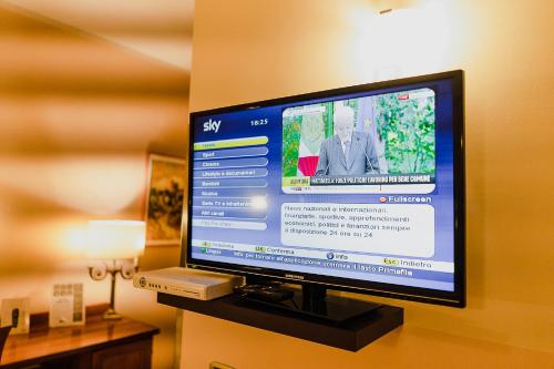 a flat screen tv sitting on a shelf at Garibaldi Home in Frosinone