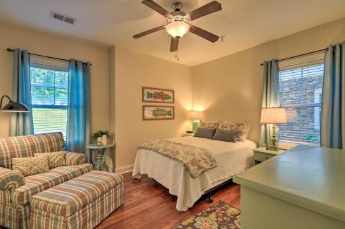 a bedroom with a bed and a ceiling fan at Sunset Cove Condo Access to Lake Sinclair in Sparta