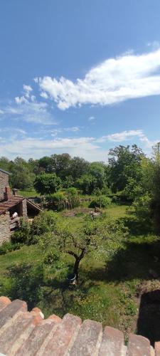 a view of a field with trees in the distance at Le nid d'Eugénie in Blaudeix