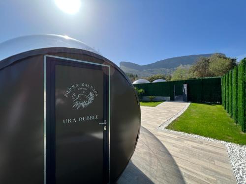 a sign for a building in a garden at Sierra Salvada Bubbles in Salmantón