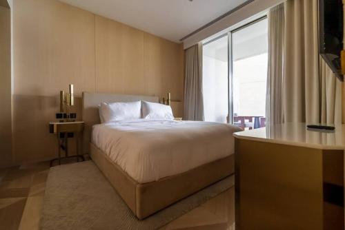 Postel nebo postele na pokoji v ubytování FIVE Palm South Residence - Vacationer