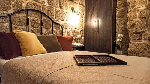 a bed with a tray on top of it at Ali Baba's Cave - Acre's Hidden Treasure in ‘Akko