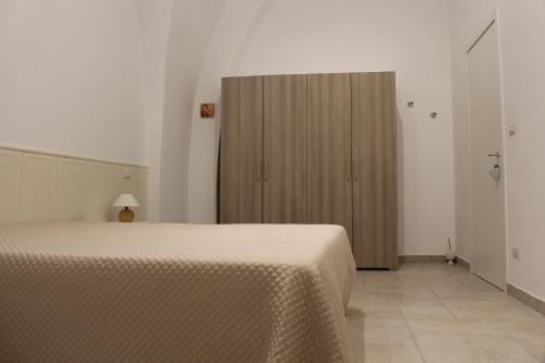 Postel nebo postele na pokoji v ubytování B&b Bianco Apartments