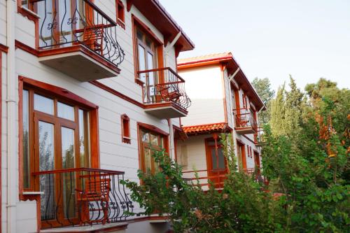 a building with balconies on the side of it at Sinop Antik Otel in Sinop