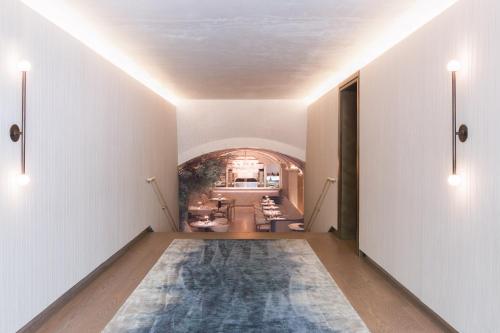 a hallway with a large rug on the floor at The Hermitage Hotel in Nashville