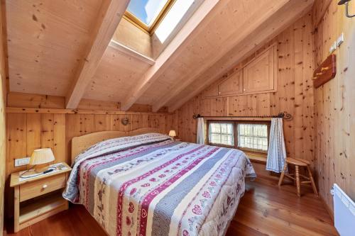 Ένα ή περισσότερα κρεβάτια σε δωμάτιο στο Appartamento Catinaccio Rosengarten