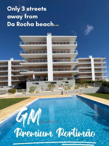 a large apartment building with a swimming pool at GM Premium Portimão in Portimão