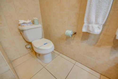 a bathroom with a toilet and a shower at Americana Condos 10th street in Ocean City